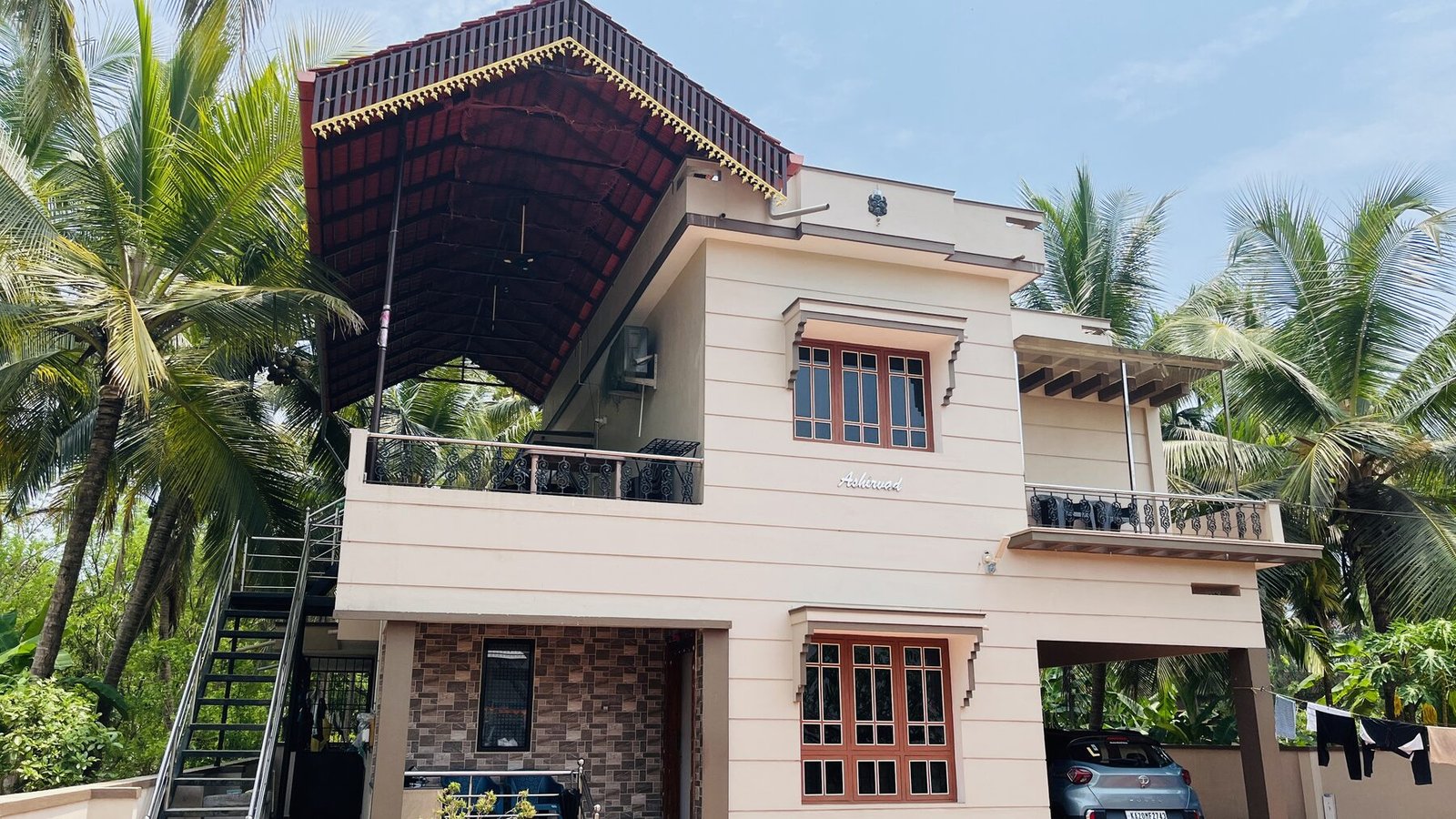 Aashirwad Beach Villa facade among coconut palms