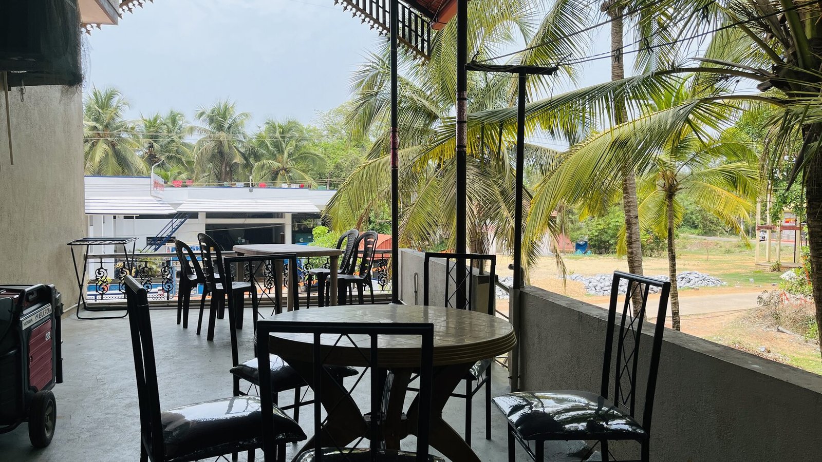 Upper balcony dining with palm views