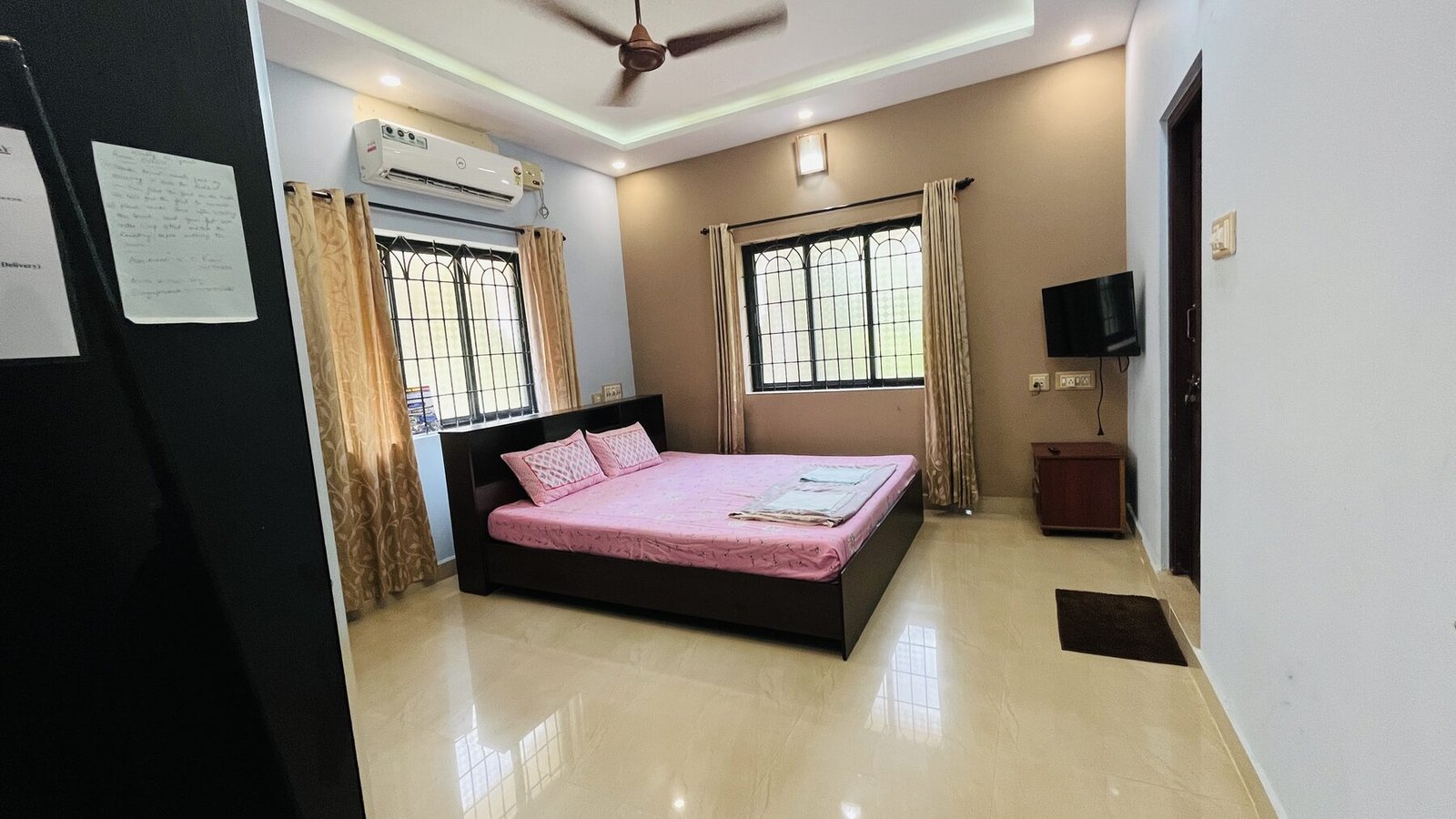 Heritage Suite bedroom with dark wood furnishings